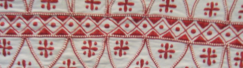 Traditionellt broderi i rött och vitt