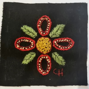 Broderi, blomma på svart vadmal